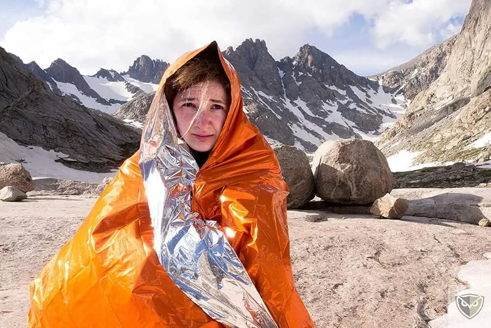 Comment utiliser une couverture de survie?